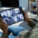 Person,Monitoring,Cameras,Live,View,Of,Home,On,The,Digital