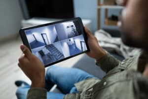 Person,Monitoring,Cameras,Live,View,Of,Home,On,The,Digital