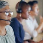 Senior,Agent,Face,,Call,Center,And,Woman,On,Phone,Call