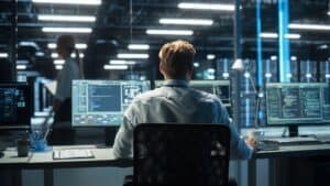 Back,View,Of,Skilled,Focused,System,Administrator,Or,Consultant,Checks