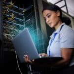 Laptop,,Network,And,Data,Center,With,A,Black,Woman,It