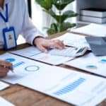 Accountant,Using,Calculator,And,Writing,On,Paper,,Business,Woman,Working