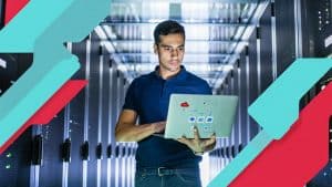 Cloud computing and network management expert working in a data center with servers.