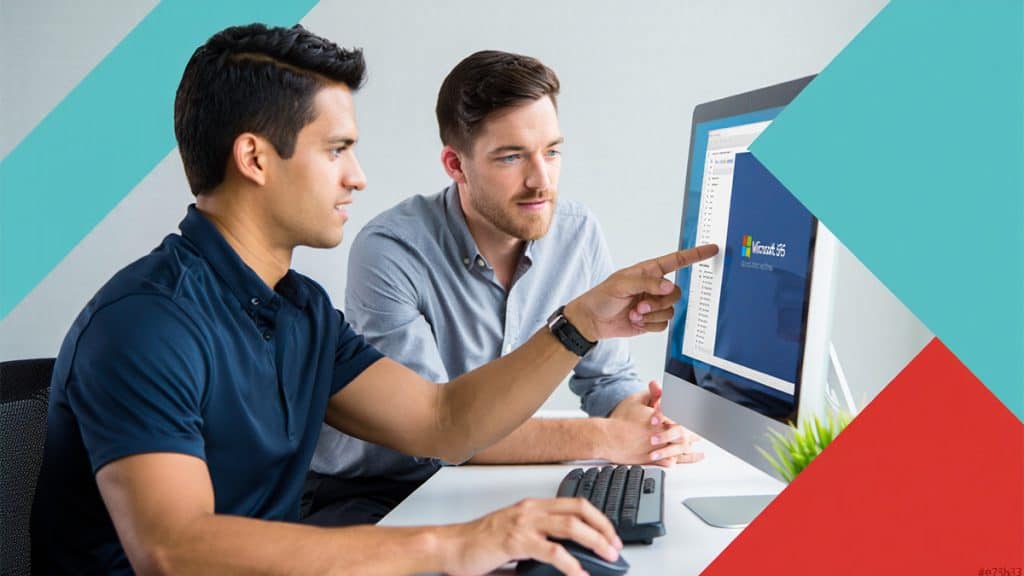 Innovative IT support team working on Microsoft Office 365 on desktop computer at CNiC Solutions.