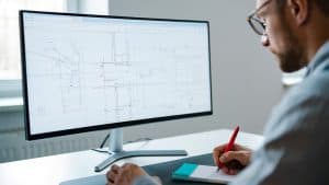 Precise technical engineering design on computer screen for IT infrastructure and network solutions.