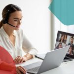 Remote IT support team member providing virtual assistance via laptop for business technology solutions.