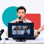 Professional man conducting virtual meeting with multiple colleagues on computer screen for IT services and remote collaboration.