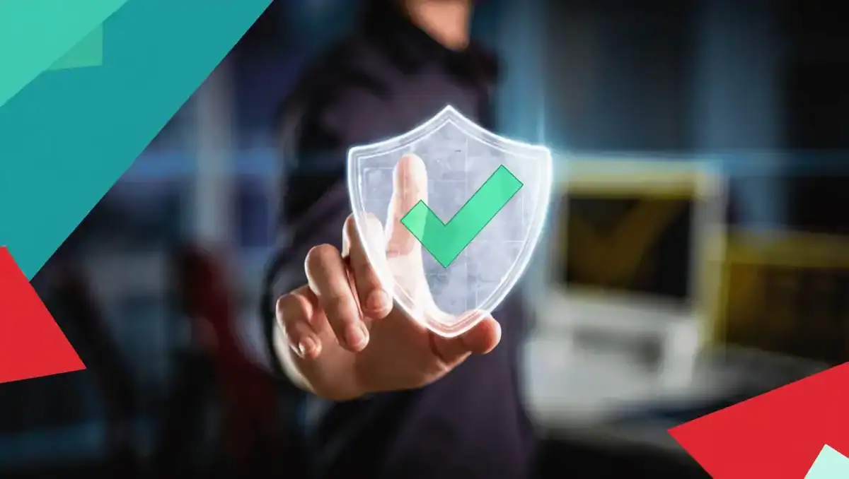 Business professional touching a digital shield with a checkmark, symbolizing cybersecurity and data protection services.