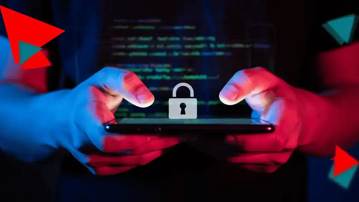 Hacker with hands holding a smartphone with a lock icon, symbolizing cybersecurity and data protection services by CNiC Solutions.