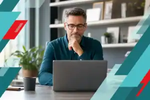 Business professional working on a laptop with IT infrastructure background in Houston.