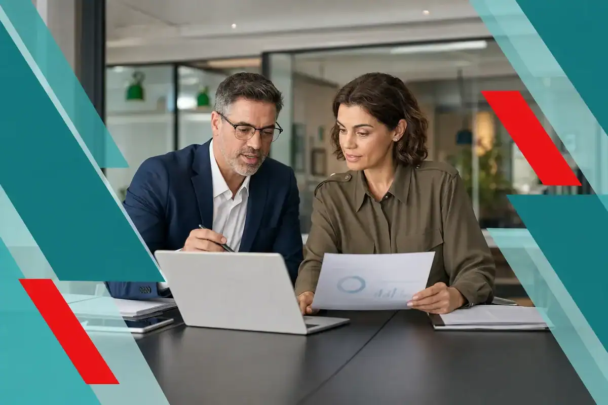 Business owner reviewing an IT budget with a technology advisor