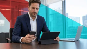 Business professional reviewing smartphone and tablet security on a modern office desk