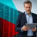 IT professional reviewing infrastructure with rows of rack servers in the background