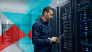 IT professional securing business infrastructure and server racks in a network operations center