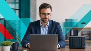 Business manager reviewing files with a multi-bay NAS storage device on the desk in a modern office