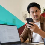 Person looking skeptically at a payment app email on their phone at a desk, wary of a possible scam