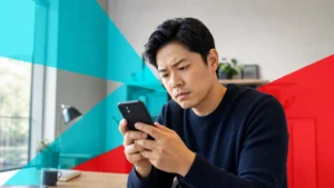 Person examining a suspicious text message on a smartphone to decide if it is a scam