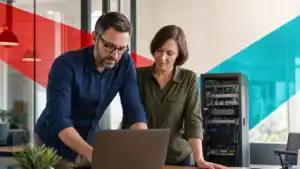 IT professionals collaborating on network infrastructure and cybersecurity solutions in a modern office.